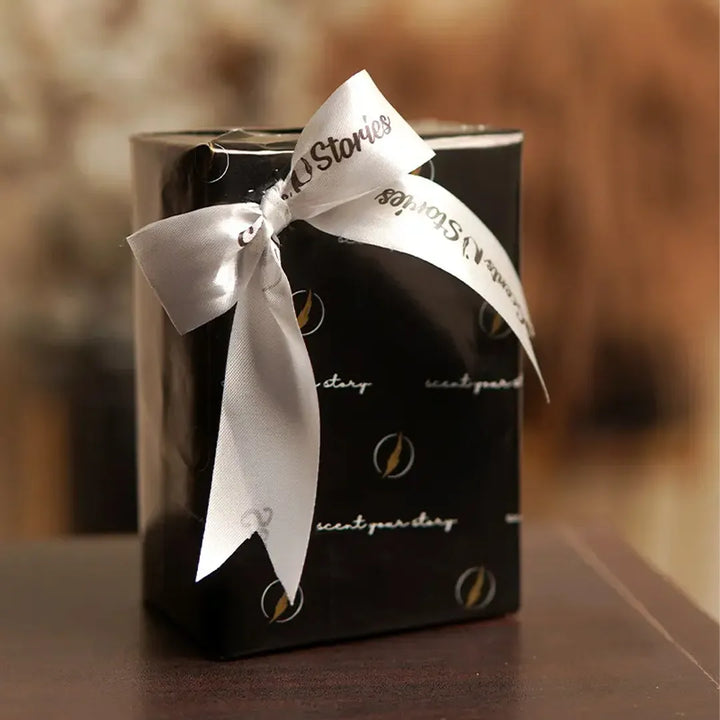 Scents N Stories ribbon-wrapped gift box for luxury perfume gifting.